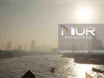 The cityscape of Bangkok, Thailand, is shrouded in a thick blanket of dust and pollution. The heavy air pollution, laden with fine particula...