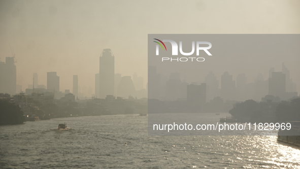 The cityscape of Bangkok, Thailand, is shrouded in a thick blanket of dust and pollution. The heavy air pollution, laden with fine particula...