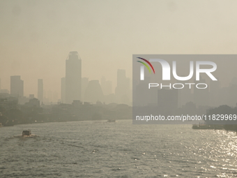 The cityscape of Bangkok, Thailand, is shrouded in a thick blanket of dust and pollution. The heavy air pollution, laden with fine particula...