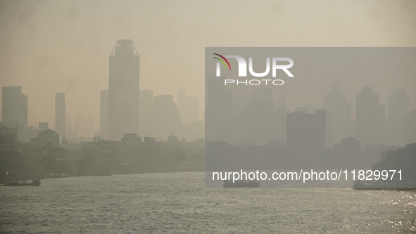 The cityscape of Bangkok, Thailand, is shrouded in a thick blanket of dust and pollution. The heavy air pollution, laden with fine particula...