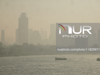 The cityscape of Bangkok, Thailand, is shrouded in a thick blanket of dust and pollution. The heavy air pollution, laden with fine particula...