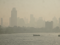 The cityscape of Bangkok, Thailand, is shrouded in a thick blanket of dust and pollution. The heavy air pollution, laden with fine particula...