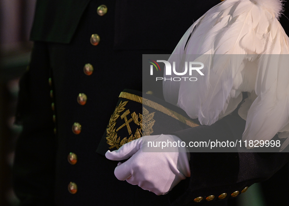 WIELICZKA, POLAND - DECEMBER 02:   
A miner holds a traditional 'Czako,' a ceremonial mining cap, which is part of the formal mining uniform...