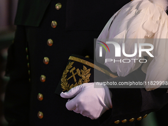 WIELICZKA, POLAND - DECEMBER 02:   
A miner holds a traditional 'Czako,' a ceremonial mining cap, which is part of the formal mining uniform...