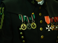 WIELICZKA, POLAND - DECEMBER 02:   
A miner proudly carries medals and badges he received during his career, pictured during the celebration...