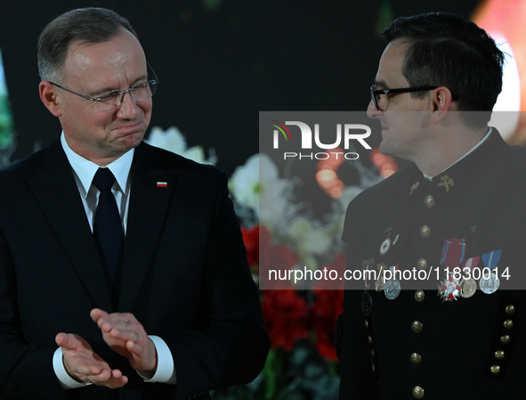 WIELICZKA, POLAND - DECEMBER 02:   
President of Poland, Andrzej Duda (L), decorates distinguished employees of the Wieliczka Salt Mine duri...