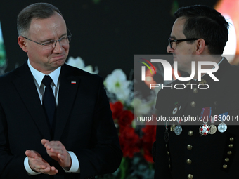 WIELICZKA, POLAND - DECEMBER 02:   
President of Poland, Andrzej Duda (L), decorates distinguished employees of the Wieliczka Salt Mine duri...