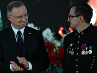 WIELICZKA, POLAND - DECEMBER 02:   
President of Poland, Andrzej Duda (L), decorates distinguished employees of the Wieliczka Salt Mine duri...