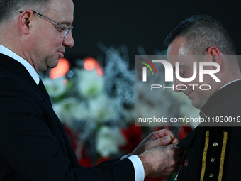 WIELICZKA, POLAND - DECEMBER 02:   
President of Poland, Andrzej Duda (L), decorates distinguished employees of the Wieliczka Salt Mine duri...