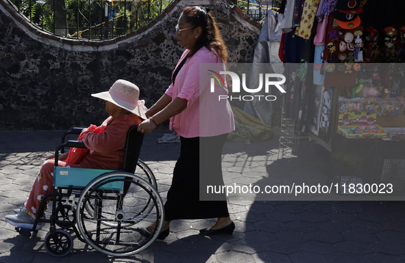 Visitors attend the Christmas Bazaar in the Tlahuac municipality in Mexico City, Mexico, on December 2, 2024, where the capital offers the s...