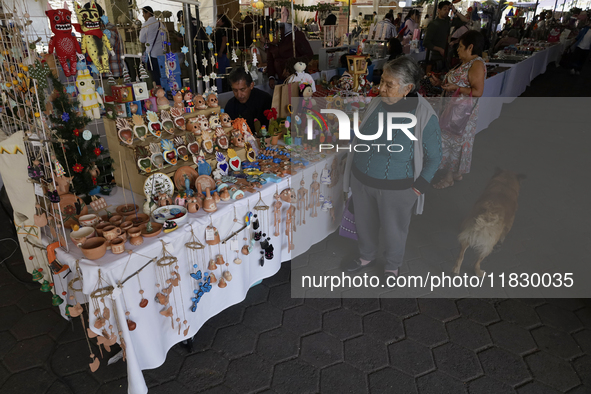 Visitors attend the Christmas Bazaar in the Tlahuac municipality in Mexico City, Mexico, on December 2, 2024, where the capital offers the s...