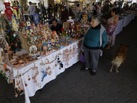 Visitors attend the Christmas Bazaar in the Tlahuac municipality in Mexico City, Mexico, on December 2, 2024, where the capital offers the s...