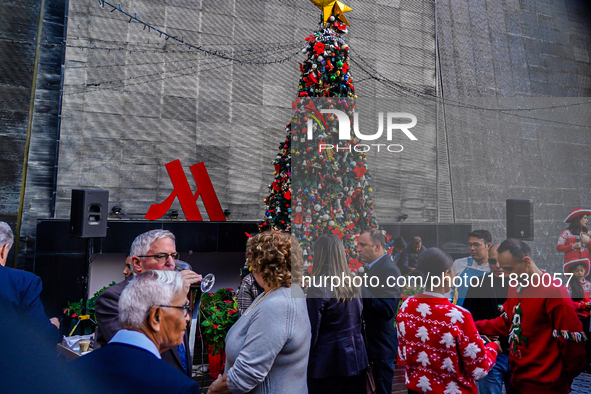 People participate in the Christmas tree lighting ceremony at the Marriott Hotel in Kathmandu, Nepal, on December 1, 2024. 