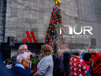 People participate in the Christmas tree lighting ceremony at the Marriott Hotel in Kathmandu, Nepal, on December 1, 2024. (