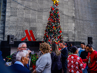 People participate in the Christmas tree lighting ceremony at the Marriott Hotel in Kathmandu, Nepal, on December 1, 2024. (