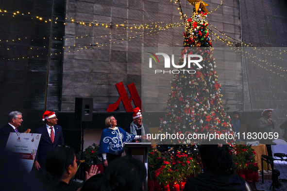 People participate in the Christmas tree lighting ceremony at the Marriott Hotel in Kathmandu, Nepal, on December 1, 2024. 