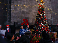 People participate in the Christmas tree lighting ceremony at the Marriott Hotel in Kathmandu, Nepal, on December 1, 2024. (