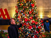 People participate in the Christmas tree lighting ceremony at the Marriott Hotel in Kathmandu, Nepal, on December 1, 2024. (