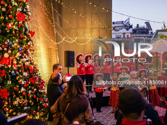 People participate in the Christmas tree lighting ceremony at the Marriott Hotel in Kathmandu, Nepal, on December 1, 2024. (