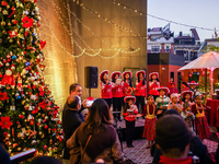 People participate in the Christmas tree lighting ceremony at the Marriott Hotel in Kathmandu, Nepal, on December 1, 2024. (