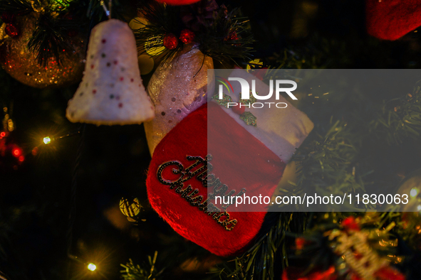 People participate in the Christmas tree lighting ceremony at the Marriott Hotel in Kathmandu, Nepal, on December 1, 2024. 