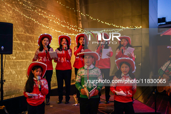 People participate in the Christmas tree lighting ceremony at the Marriott Hotel in Kathmandu, Nepal, on December 1, 2024. 