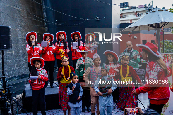 People participate in the Christmas tree lighting ceremony at the Marriott Hotel in Kathmandu, Nepal, on December 1, 2024. 