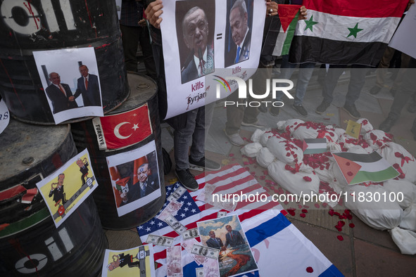 Iranian protesters hold a Syrian flag and an anti-Turkish President placard featuring portraits of the Turkish President and Israeli Prime M...