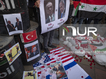 Iranian protesters hold a Syrian flag and an anti-Turkish President placard featuring portraits of the Turkish President and Israeli Prime M...