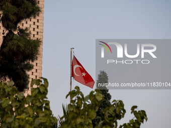 A Turkish flag waves at the Turkish embassy during a protest against Turkish President Recep Tayyip Erdogan and his diplomacy regarding rece...