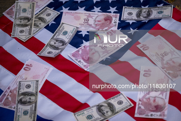 Copies of the U.S. Dollar and Turkish Lira banknotes are placed by Iranian protesters on the U.S. flag during a protest against Turkish Pres...