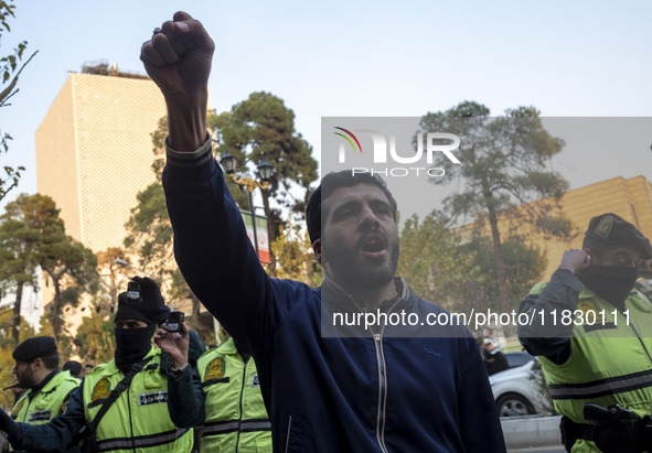 An Iranian protester shouts anti-U.S. and anti-Turkish President slogans while taking part in a protest against Turkish President Recep Tayy...