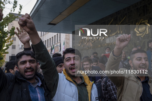 Iranian protesters shout anti-U.S. and anti-Turkish President slogans while participating in a protest against Turkish President Recep Tayyi...