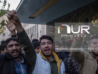 Iranian protesters shout anti-U.S. and anti-Turkish President slogans while participating in a protest against Turkish President Recep Tayyi...