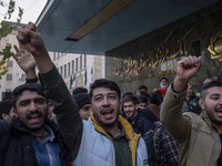 Iranian protesters shout anti-U.S. and anti-Turkish President slogans while participating in a protest against Turkish President Recep Tayyi...