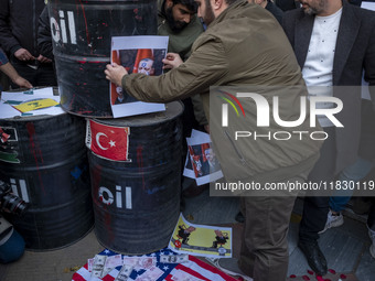 Copies of the U.S. Dollar and Turkish Lira banknotes, along with a poster featuring portraits of Turkish President Recep Tayyip Erdogan and...