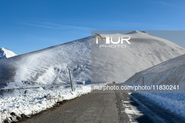 A winding road through snowy hills is seen in Campo Imperatore, Gran Sasso d'Italia, Italy, on November 16, 2024.  