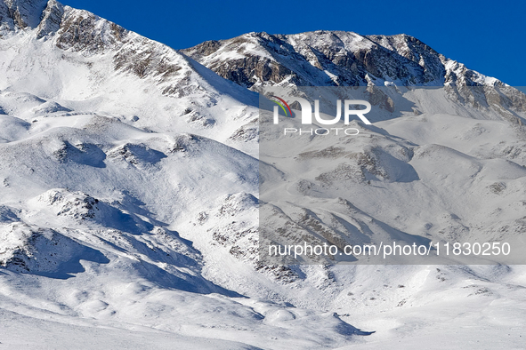 Shadows on the snow-covered slopes of the Gran Sasso massif in Campo Imperatore, Gran Sasso d'Italia, Italy, on November 16, 2024.  