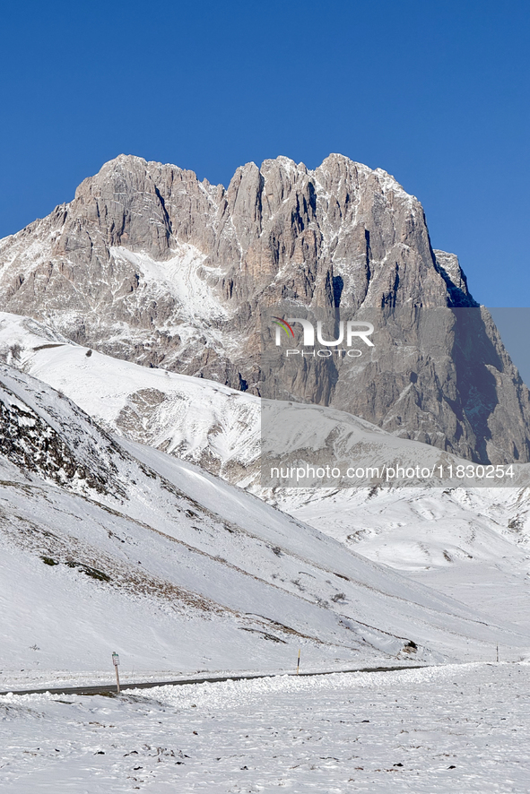 The Corno Grande peak is seen above a snow-covered road in Campo Imperatore, Gran Sasso d'Italia, Italy, on November 16, 2024.  