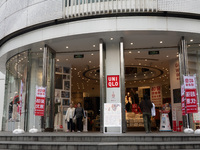 Customers pass by Uniqlo's global flagship store as it celebrates its 40th anniversary in Shanghai, China, on December 3, 2024. (