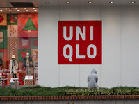 Customers pass by Uniqlo's global flagship store as it celebrates its 40th anniversary in Shanghai, China, on December 3, 2024. (