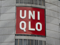 Customers pass by Uniqlo's global flagship store as it celebrates its 40th anniversary in Shanghai, China, on December 3, 2024. (