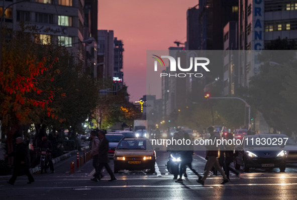 A view of a street in downtown Tehran, Iran, on December 2, 2024, at sunset. 