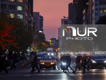 A view of a street in downtown Tehran, Iran, on December 2, 2024, at sunset. (