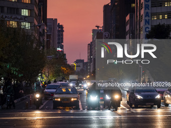 A view of a street in downtown Tehran, Iran, on December 2, 2024, at sunset. (