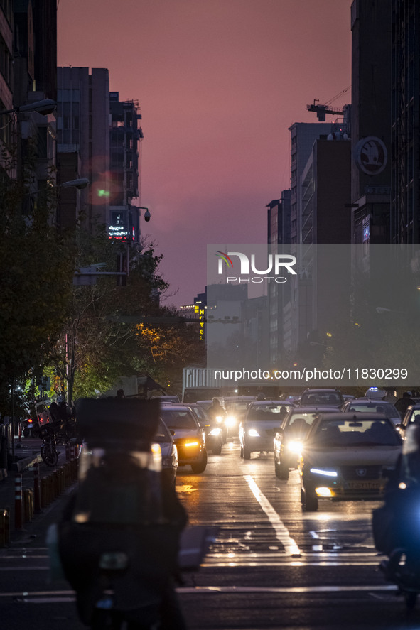 A view of a street in downtown Tehran, Iran, on December 2, 2024, at sunset. 