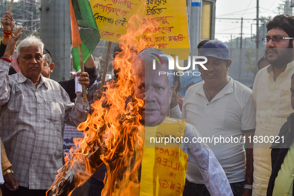 Protestors burn an effigy of Muhammad Yunus during a protest organized by South Kolkata District Congress in Kolkata, India, on December 3,...