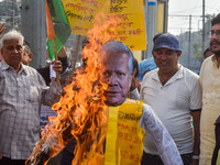 Protestors burn an effigy of Muhammad Yunus during a protest organized by South Kolkata District Congress in Kolkata, India, on December 3,...