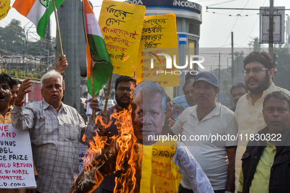 Protestors burn an effigy of Muhammad Yunus during a protest organized by South Kolkata District Congress in Kolkata, India, on December 3,...