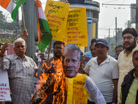 Protestors burn an effigy of Muhammad Yunus during a protest organized by South Kolkata District Congress in Kolkata, India, on December 3,...